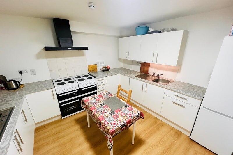 Bright and tidy kitchen featuring ample counter...