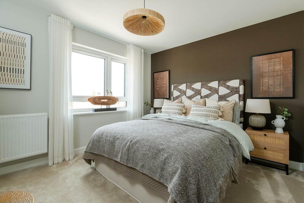The main bedroom features a luxury en suite shower room