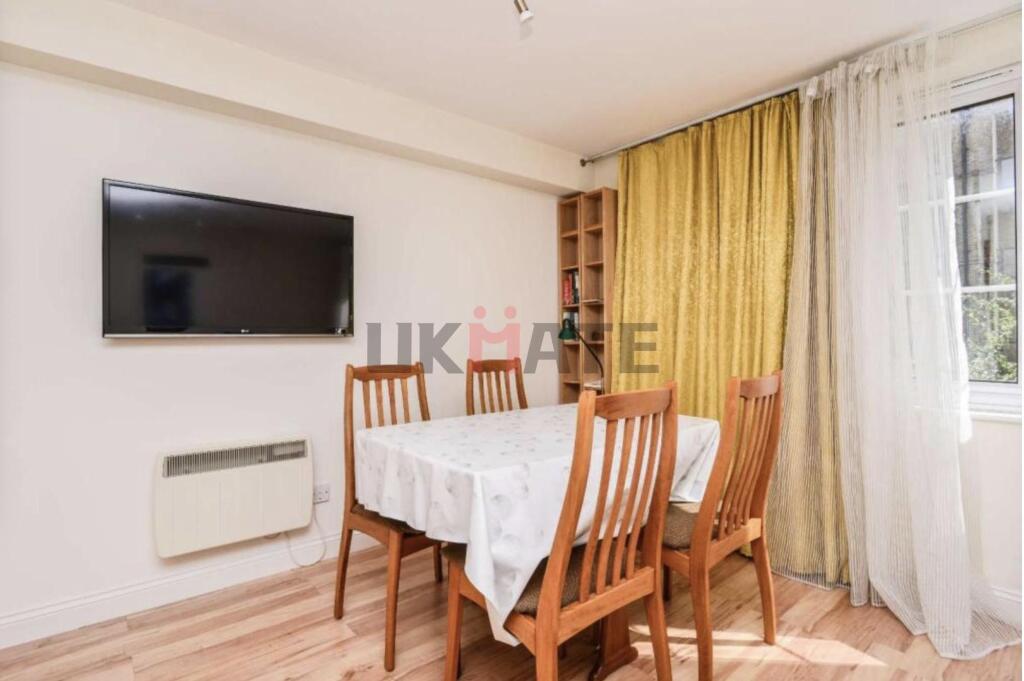 Bright and welcoming living room featuring a la...