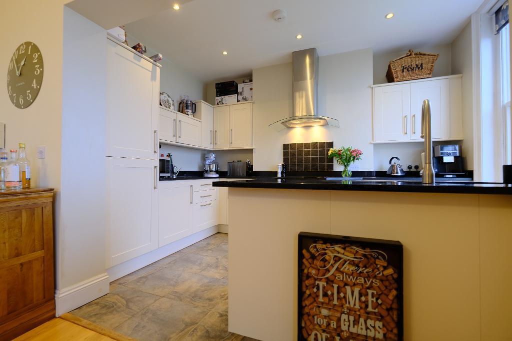 Open plan kitchen with breakfast bar