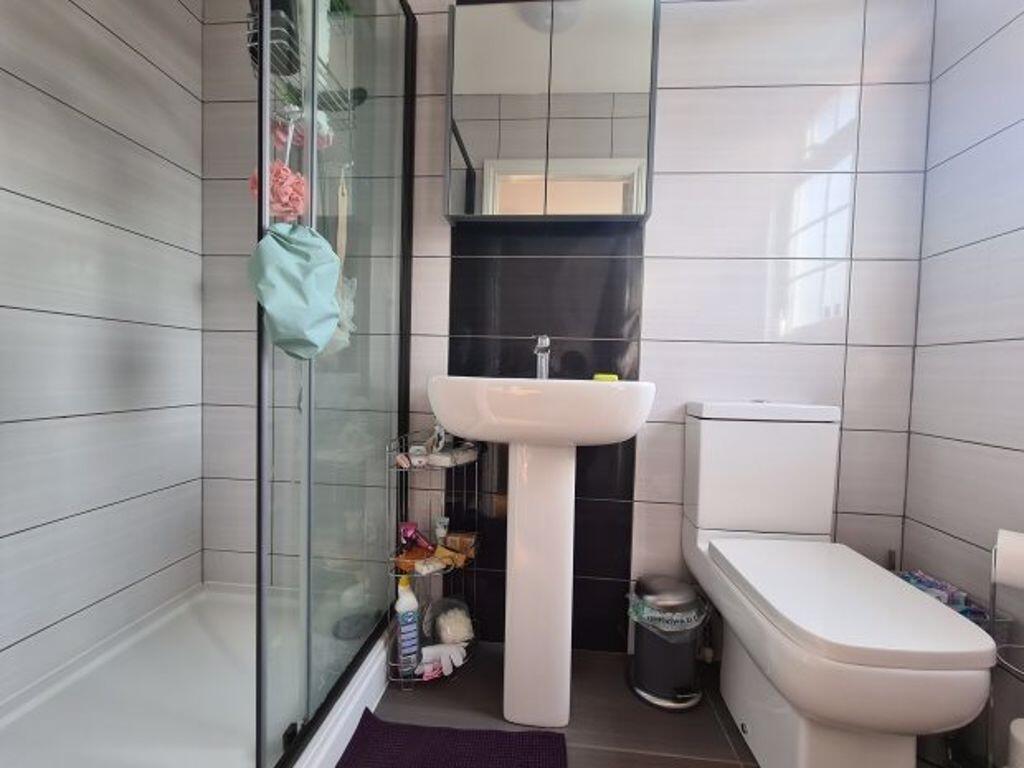 A clean, well-maintained bathroom featuring a s...