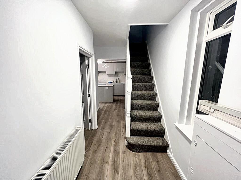 A well-maintained hallway featuring modern deco...