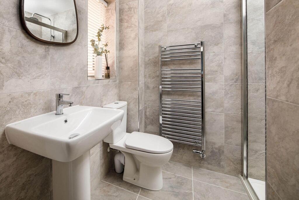 The main bedroom also hosts a private en-suite shower room