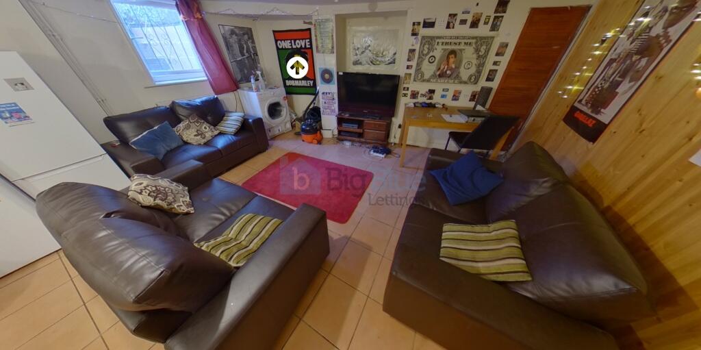 A cozy living room featuring comfortable leathe...