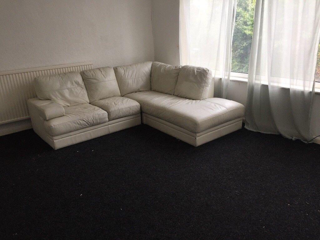 Bright corner living room with a large L-shaped...