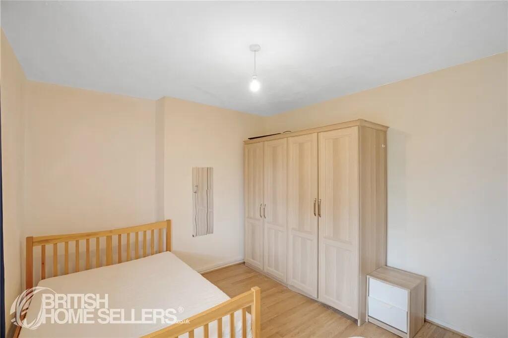 A bright and welcoming double bedroom featuring...