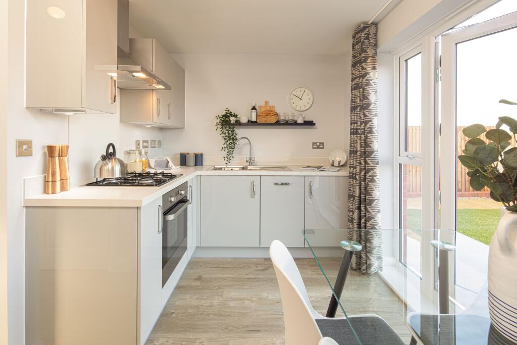 Open plan kitchen with dining area in the Kenley 2 bedroom home