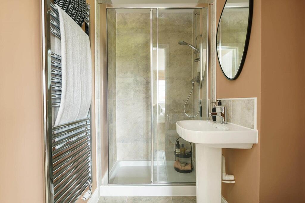 Bedroom also hosts a private en-suite shower room