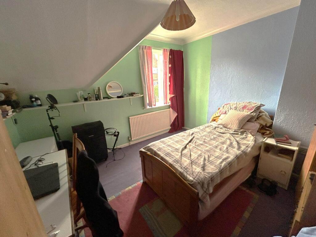 Cozy single bedroom with a comfortable bed, bed...