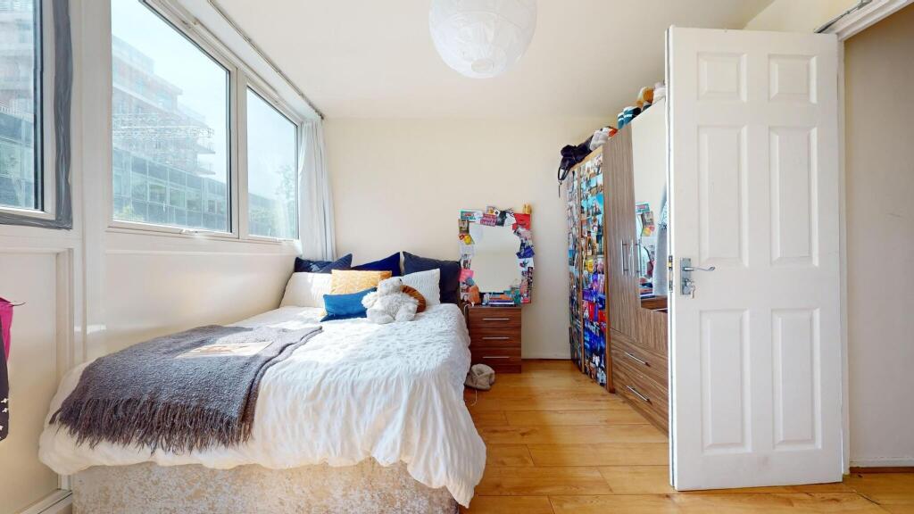 Bright and inviting double bedroom featuring a ...