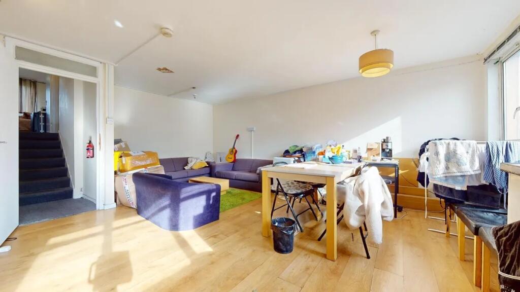 Bright living room with large windows allowing ...