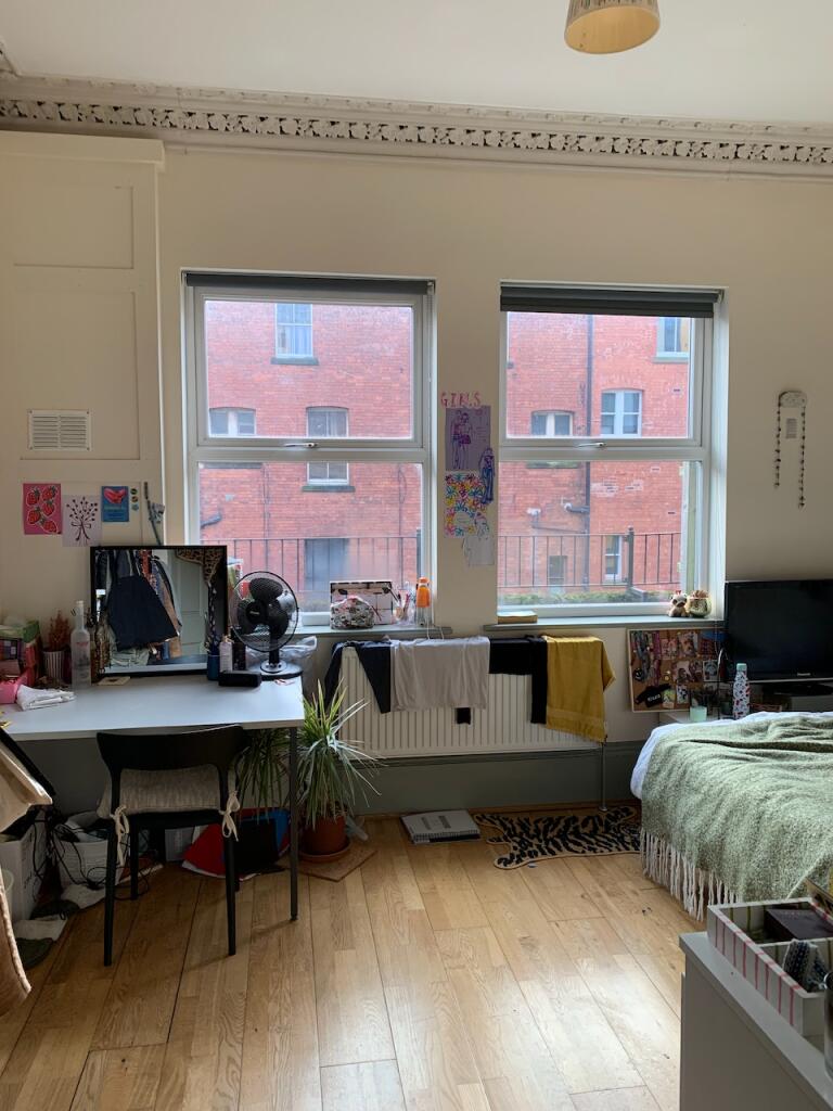 Bright and cozy double bedroom featuring large ...