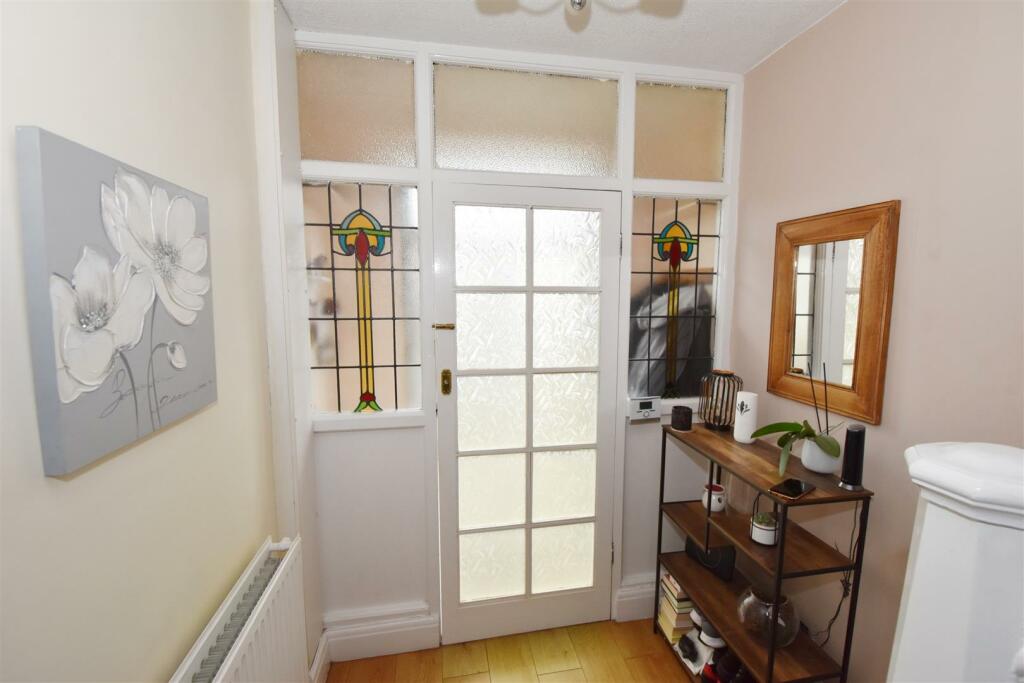 Original stained glass doors in hallway.jpg