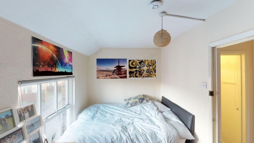Bright and cozy double bedroom featuring a comf...