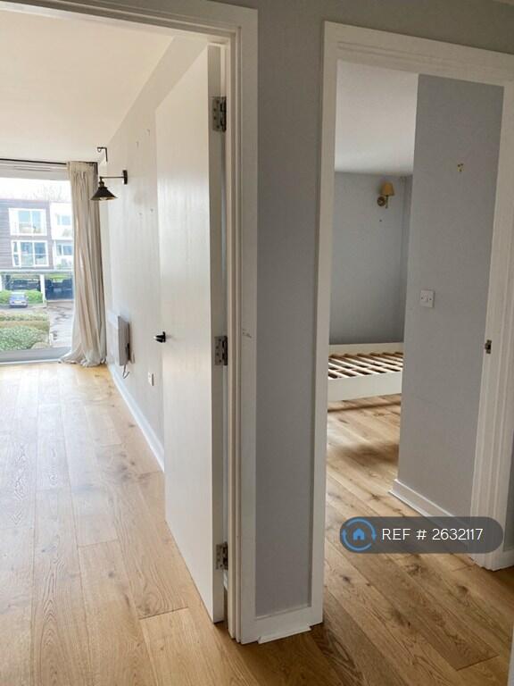 Hallway Leading To Living Room And Bathroom