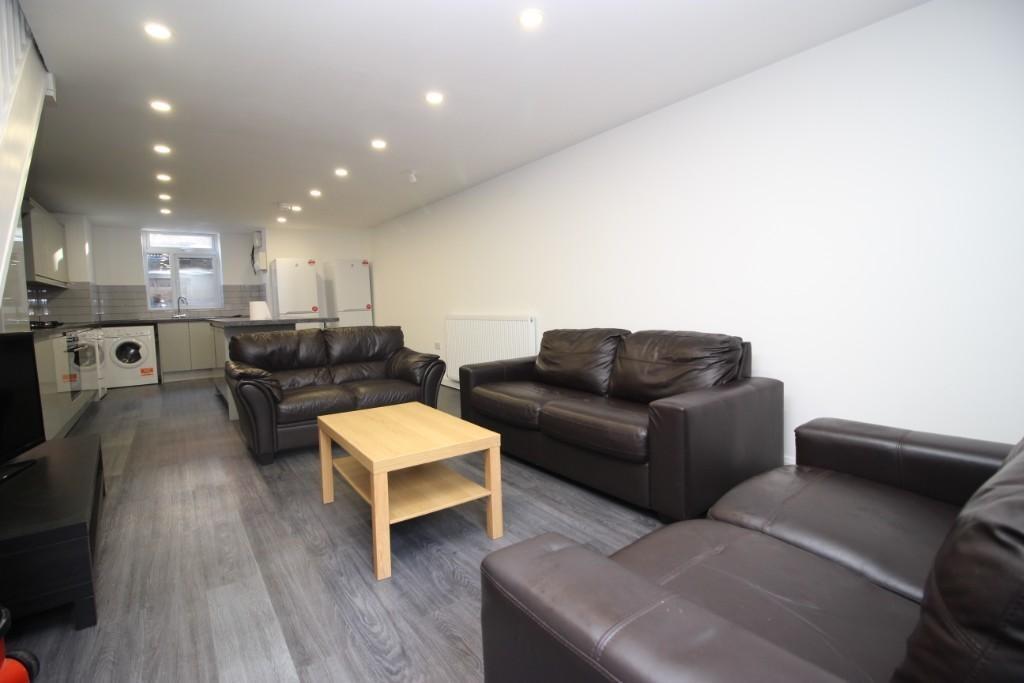 A modern, well-maintained living room featuring...