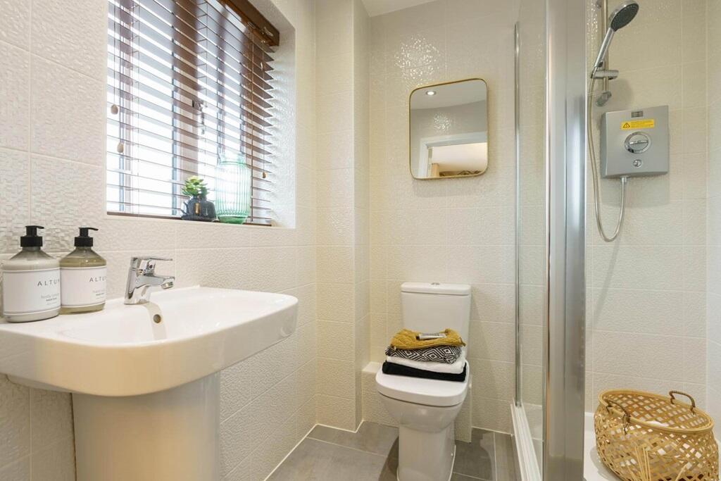 The en suite with high quality fixtures and fittings
