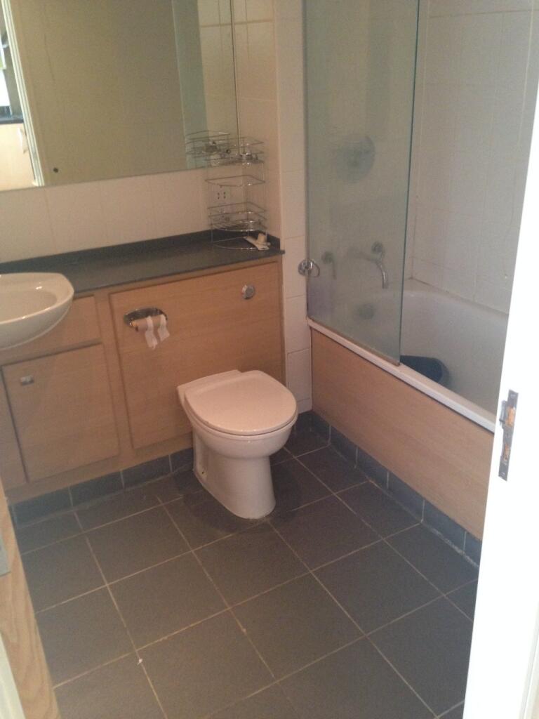 A clean and modern bathroom suite featuring a w...