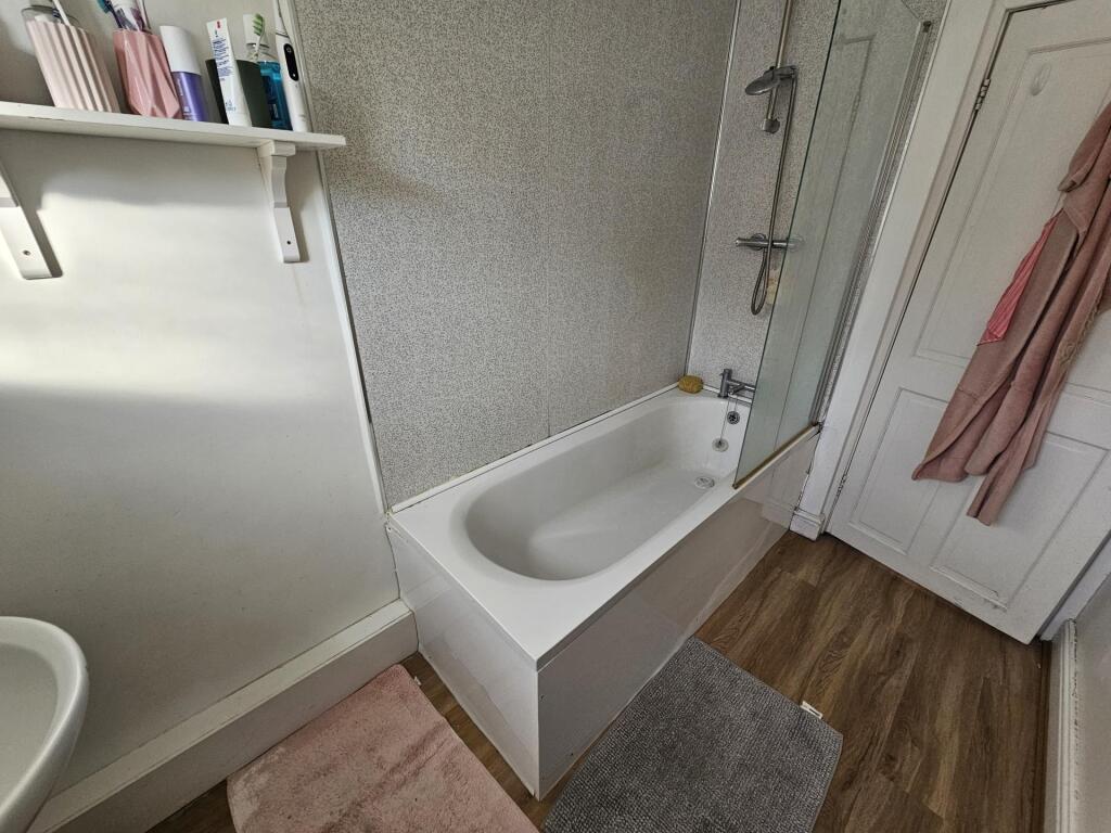 A neat and well-maintained bathroom featuring a...