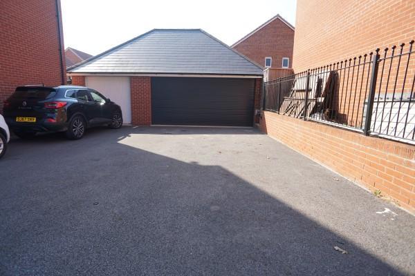 Driveway x 4 Spaces Leading to Garage