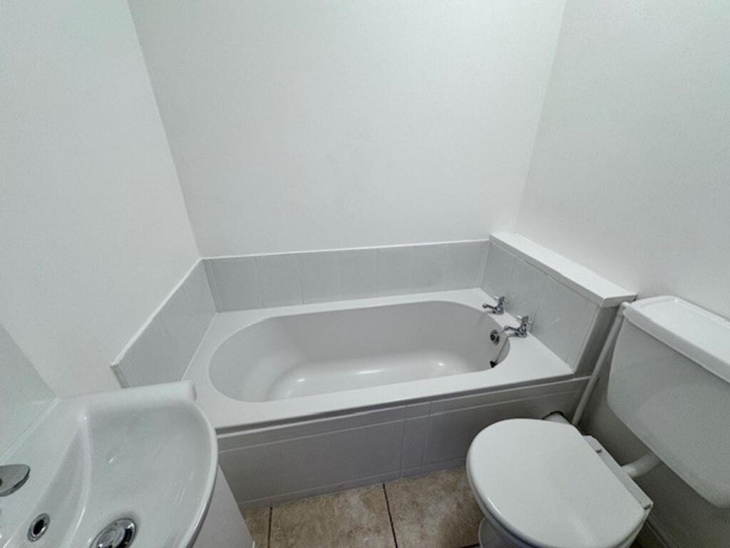 Bedroom 1  with bathroom accessed via wooden door