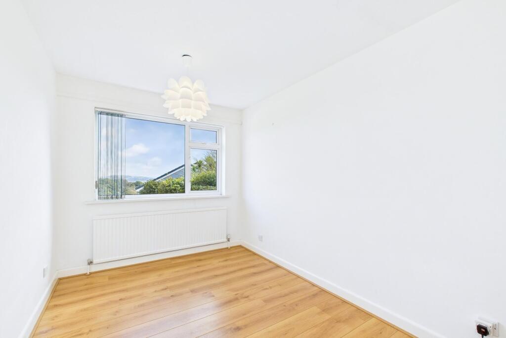 Bedroom three on ground floor with sea views