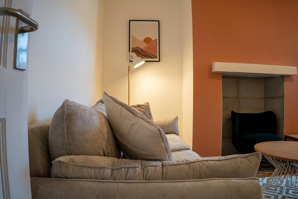 A cozy and inviting living room featuring styli...