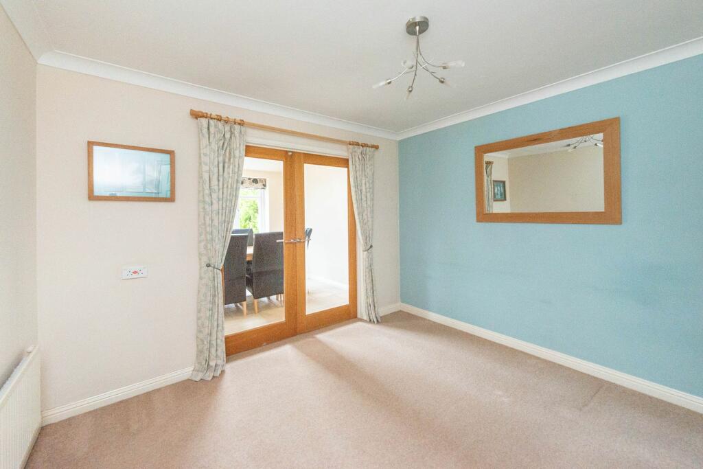 SITTING ROOM AND EXTENDED DINING KITCHEN