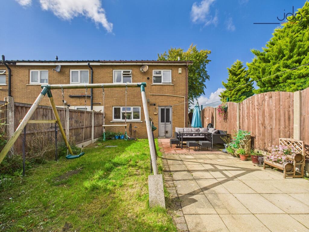 Rear garden with mix lawn and flags