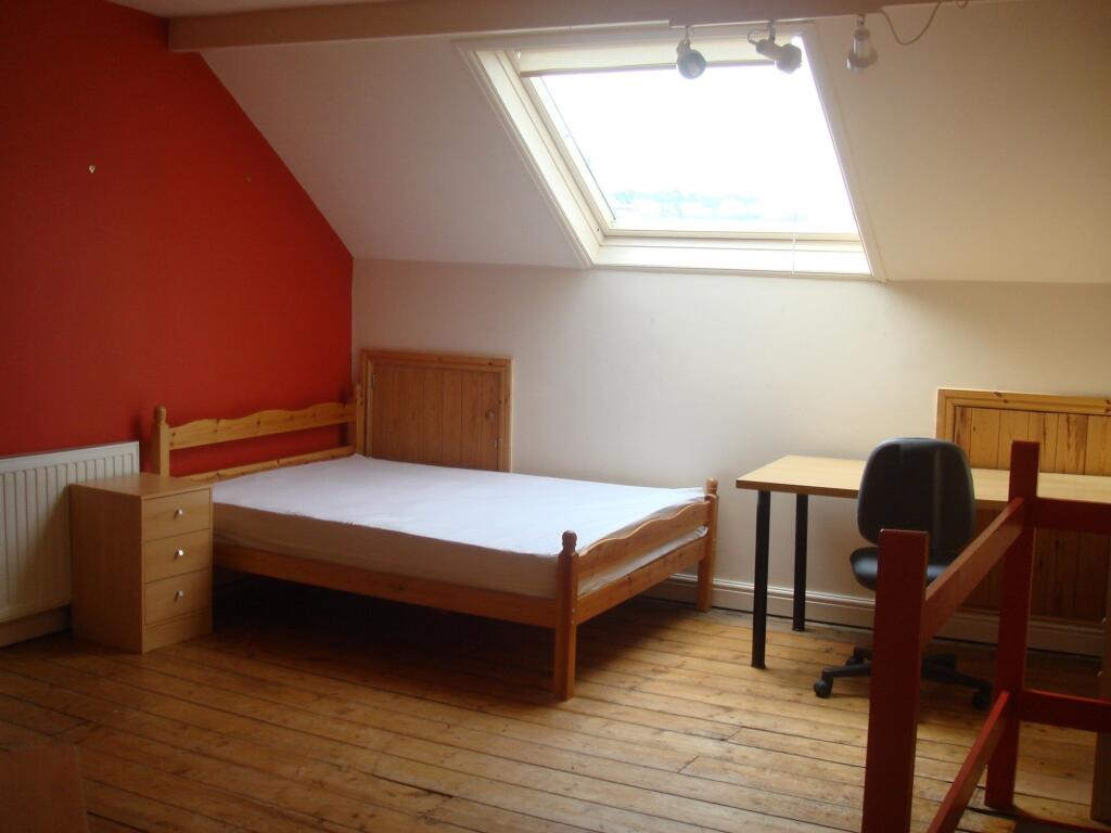 Bright and inviting double bedroom with natural...