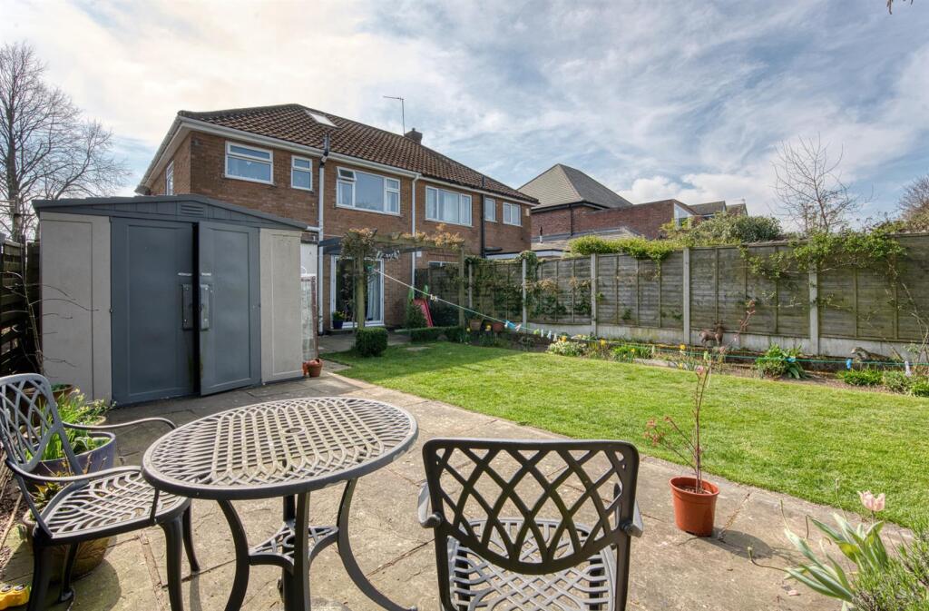 Rear dining patio and storage .jpg