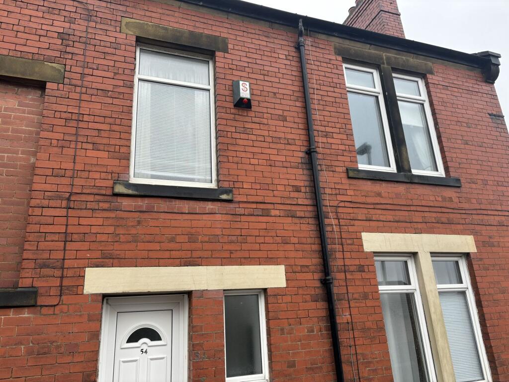 A well-maintained traditional red brick terrace...
