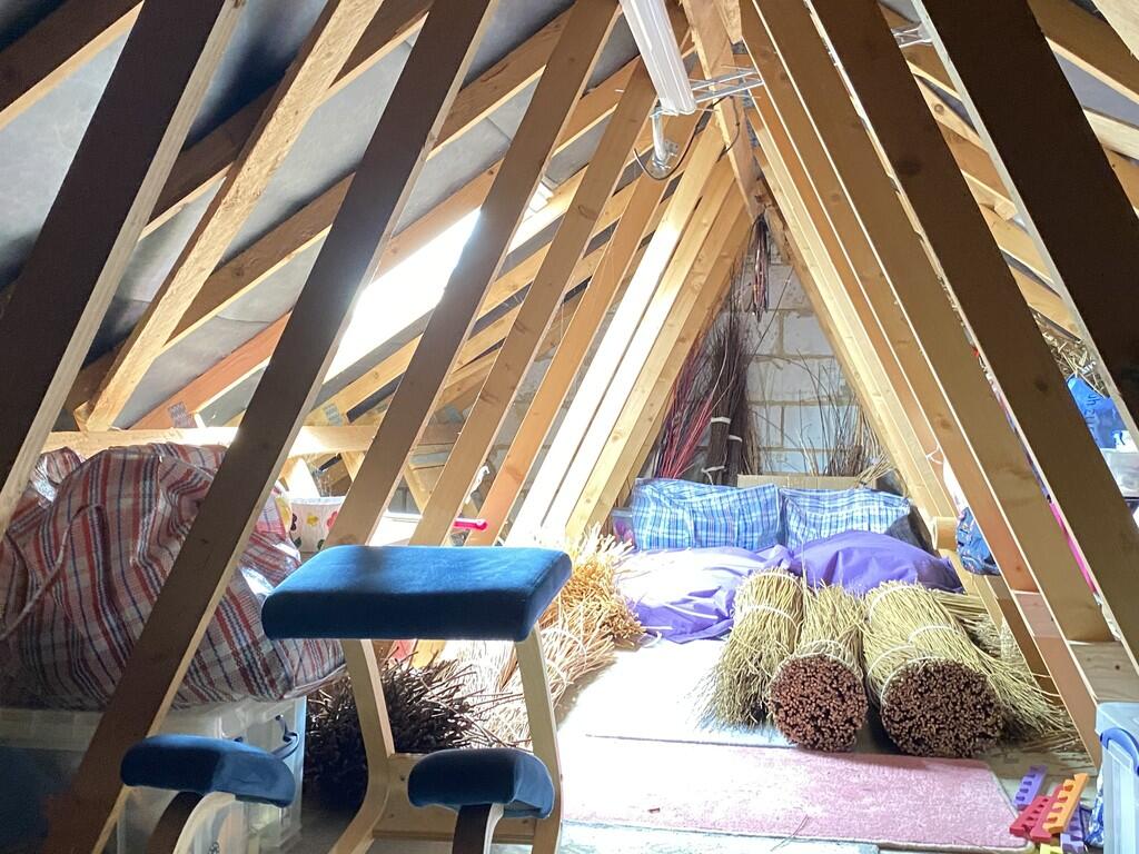 Boarded attic spa...