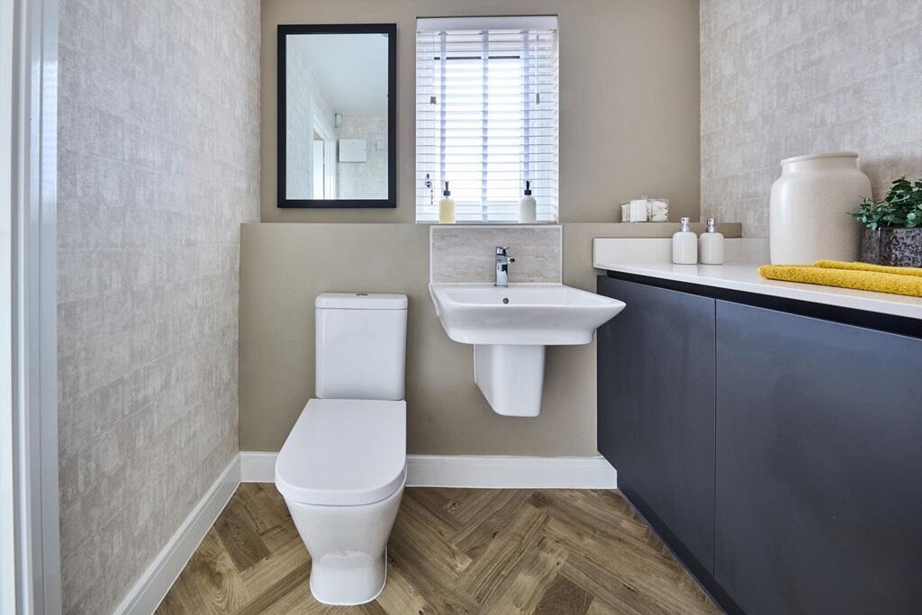 There's a convenient combined cloakroom/utility