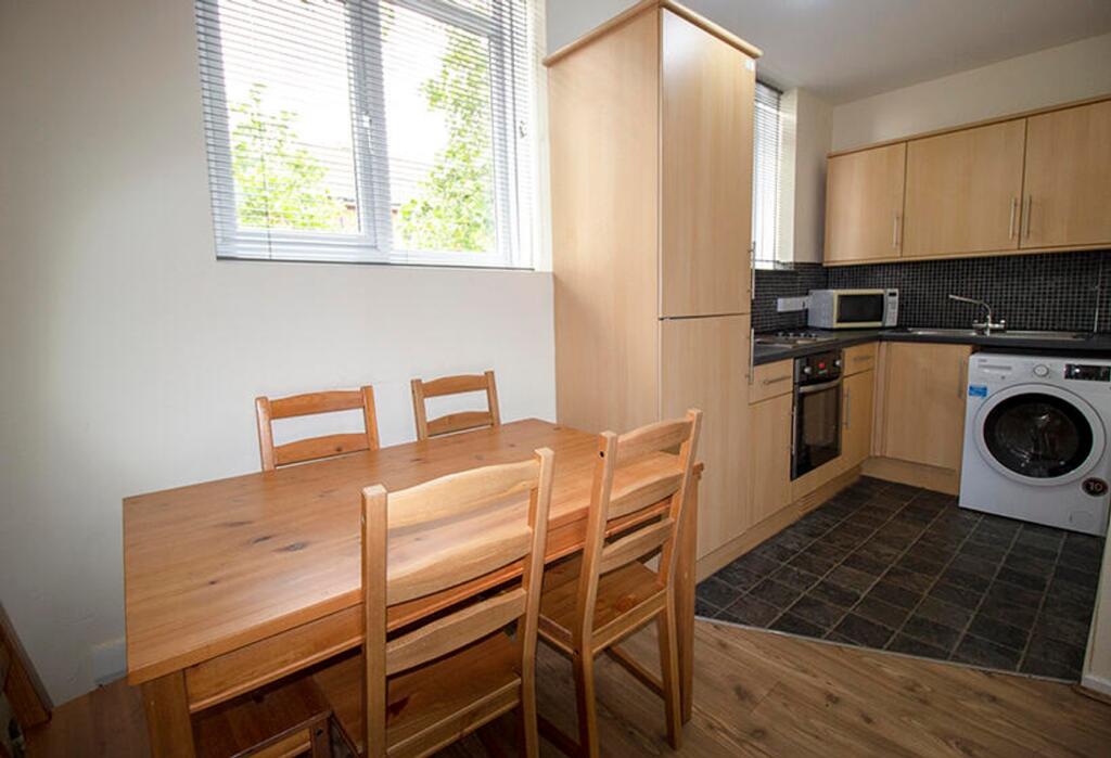 This well-appointed kitchen features modern app...