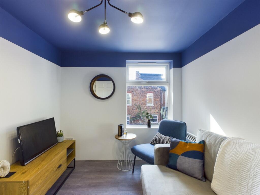 A cozy and modern living room featuring stylish...