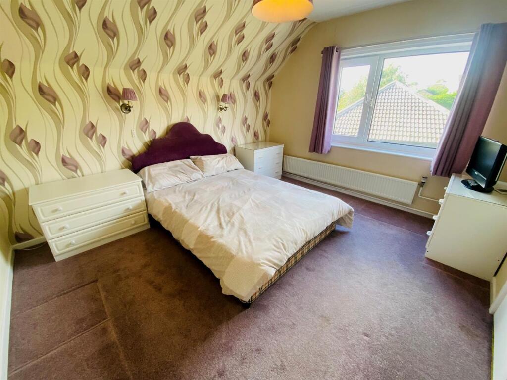 bedroom first floor with eaves access.jpg