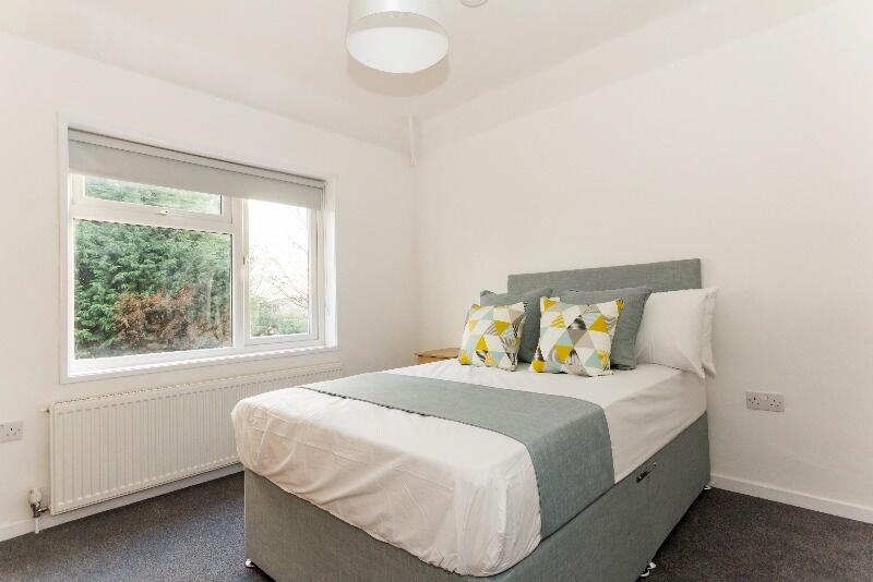 Bright and inviting double bedroom featuring a ...