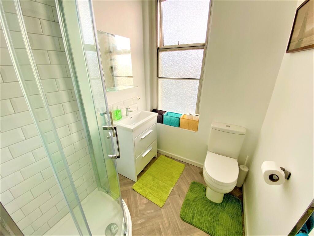 A bright and modern bathroom featuring a stylis...