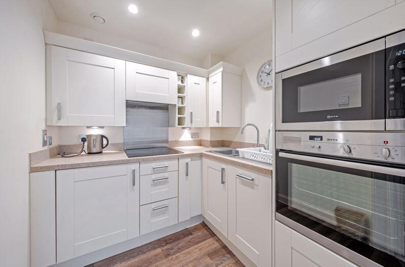 Kitchen with built-in appliances