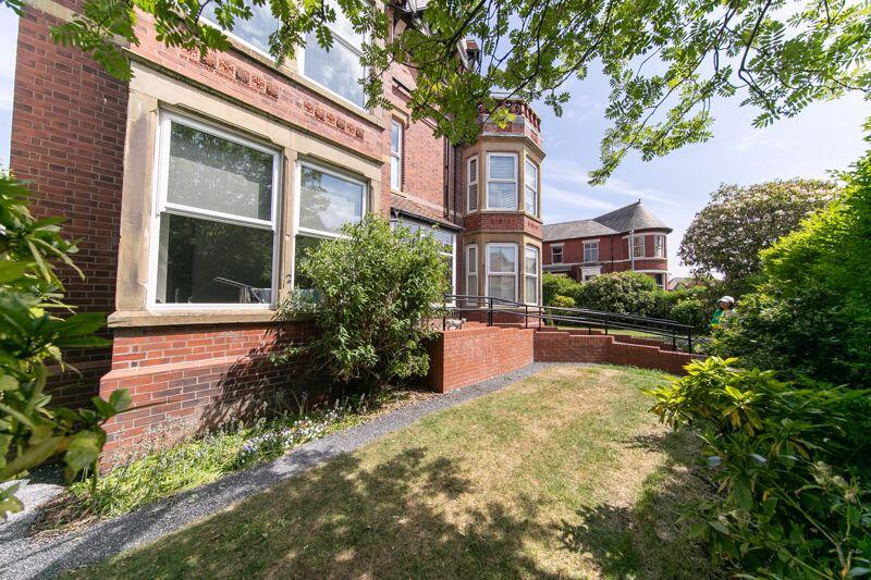 Front elevation &amp; communal gardens