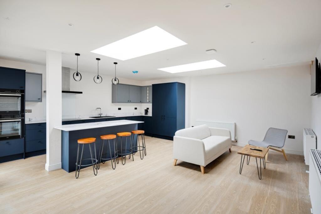 A modern and spacious kitchen with a clean desi...