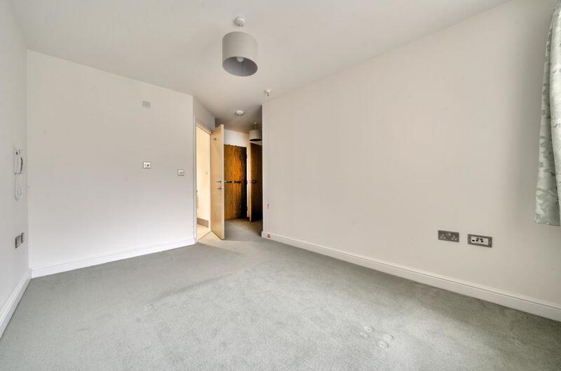 Master bedroom with fitted wardrobe a...