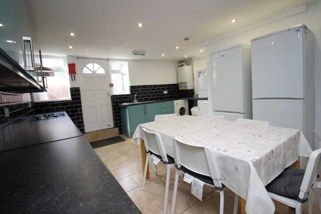 Bright and spacious kitchen featuring a large d...