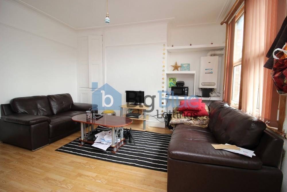 Bright and inviting living room featuring two l...