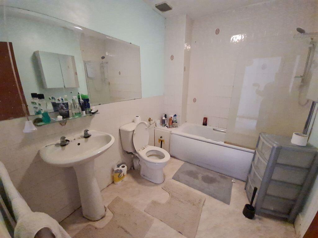 A bright and well-maintained bathroom suite fea...