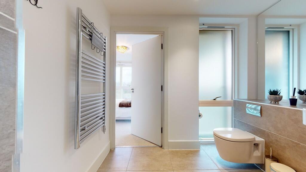 A modern and well-maintained bathroom featuring...