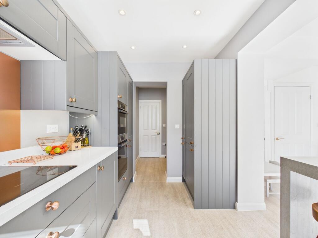 Kitchen leading into Utility