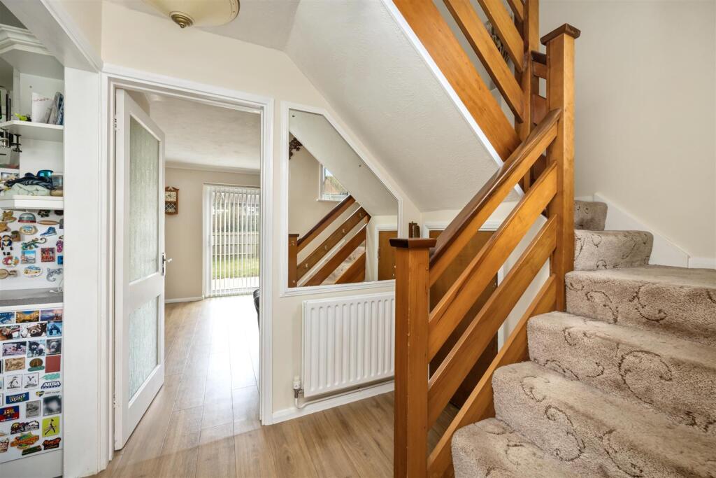 Stairs rising to First Floor