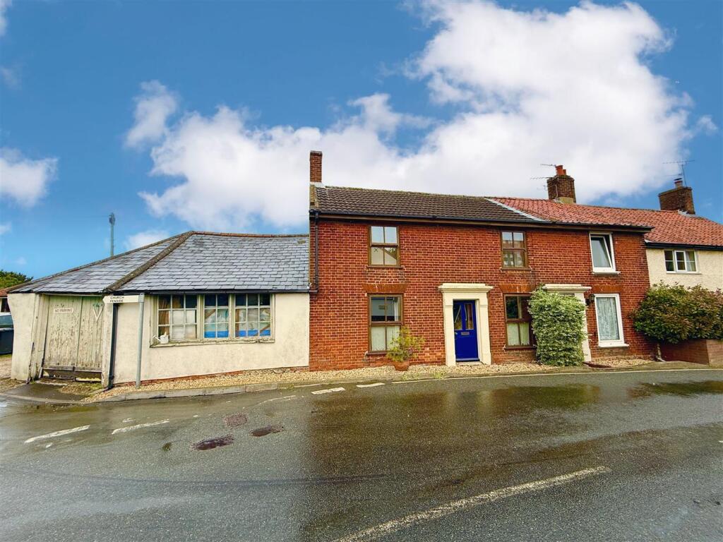 front aspect with garage to side